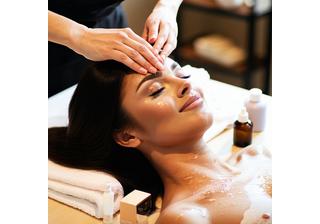 Client receiving relaxing hair treatment